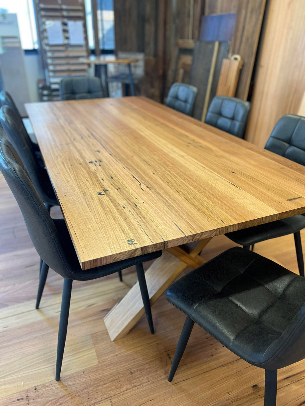 Torquay recycled Messmate dining table styled with chairs in a modern dining setting